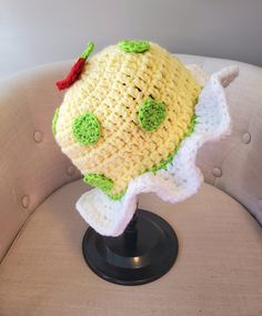 Hand crafted adorable crochet Apple dumpling character inspired bucket hat (cup cozy listed separately) This cap is perfect for Halloween, Raves, and cosplay events. One red apple applique is sewn into this hat at the top and is surrounded by green polka dots and a white ruffle trim. The circumference of this hat measures approximately 21 inches at the brim without being stretched, which will fit most adults.   Please measure accordingly and order by head circumference as sizing is an approximate. You generally want the hat size to be 2 inches smaller than your actual head circumference for a good fit. Item is made of 100% Acrylic yarn and double stranded to give it a little extra stiffness to maintain its shape. **CUP COZY LISTED SEPARATELY** **Items are READY TO SHIP.  If you desire a di Crochet Fruit Hat, Handmade Playful Bucket Hat, Lemon Bucket Hat Crochet, Playful Handmade Bucket Hat, Pumpkin Bucket Hat Crochet, Whimsical Summer Crochet Bucket Hat, Strawberry Shortcake Crochet Hat, Playful Crochet Bucket Hat, Rave Hats