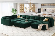 a living room filled with lots of furniture and a large green couch in front of a window