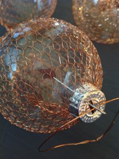 several glass balls with wire wrapped around them