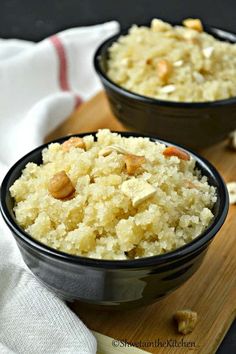 two black bowls filled with rice and nuts