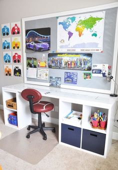 a white desk topped with drawers under a map