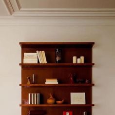 a bookshelf in the corner of a living room