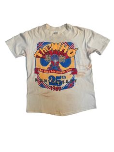 In 1989 The Who hit the road to travel around the USA to celebrate their 25th anniversary as a band. This T-shirt has the perfect wear and tear, with some orange stains scattered around the tee that may wash out if wanted. On the front of the tee there is a large graphic with The WHO printed large above a red and blue warrior lady. Throughout the shirt you can see them mixing USA flags with British flags. On the back there are all of the cities that they visited as well as "The Worlds Greatest R The Who Tshirt, 80s Band Shirts, Blue Warrior, 80s Band Tees, 90s Culture, Vintage Concert T Shirts, Vintage Rock Tees, Culture Fashion, Rock Tees