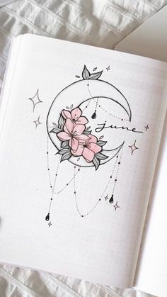 an open notebook with flowers and stars on it