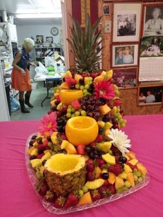 there is a very large platter of fruit on the table