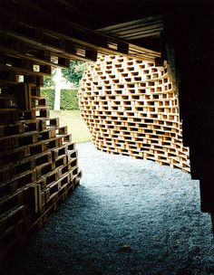 several stacks of wooden crates stacked on top of each other