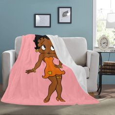 an image of a cartoon character on a pink blanket that is covering a couch in the living room