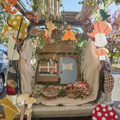 the back of a van decorated with paper decorations