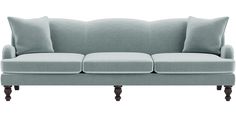 a light blue couch with three pillows on it's back and two legs, against a white background