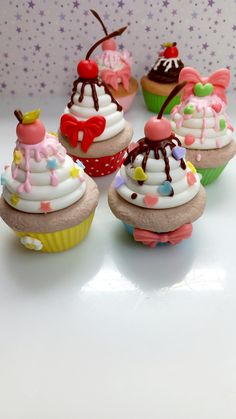 several cupcakes with different toppings on them