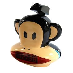 an alarm clock with a monkey face on it's head and the time displayed