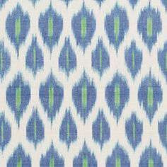 a blue and green pattern on fabric