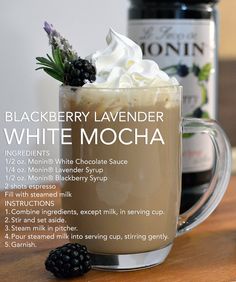 the ingredients for blackberry lavender white mocha are displayed in front of a mug with whipped cream and blackberries