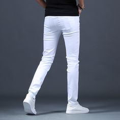 White Fitted Cotton Bottoms, Fitted White Cotton Bottoms, White Slim Fit Pants With Pockets, White Slim Fit Bottoms For Spring, White Slim Fit Straight Leg Pants, Casual White Cotton Bottoms, Trendy Stretch Cotton Jeans, Trendy Slim Spring Pants, White Slim Fit Bottoms With Pockets