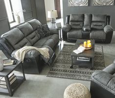 a living room with two couches and a coffee table