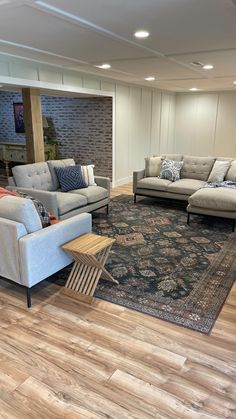 a living room filled with furniture and a rug