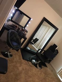 a chair sitting in front of a mirror on top of a floor