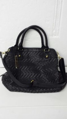 This Auction is for a Brand New with Tags NILA ANTHONY WOVEN SATCHEL BLACK HANDBAG WITH CHAIN HANDLE.   Top zipper closure. Measures approx. 12" Height, 15" Length, 5" Width. Faux black leather with weave design. Gold tone metal. 1 exterior pocket. Lining: polyester. 3 pockets inside. One of the pockets is sized to hold a cell phone. Attachable gold tone and faux black leather woven through gold tone chain hand carry strap: 6" drop. Two fixed hand carry straps have a 6” drop. Additional attachab Top Handle Satchel With Handles As Fashion Accessory, Black Satchel With Braided Handles For Daily Use, Chic Handheld Satchel With Braided Handles, Trendy Satchel With Zipper Closure, Trendy Satchel Hobo Bag, Black Satchel With Braided Handles, Black Satchel With Braided Handles For Travel, Satchel Shoulder Bag With Top Carry Handle, Fall Satchel Bag With Braided Handles