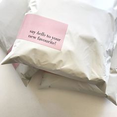 a pillow with a pink sticker that says say i hate to your new favorite