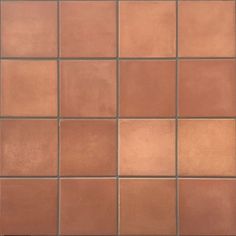 a close up view of a brown tile wall