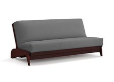 a gray couch sitting on top of a wooden frame