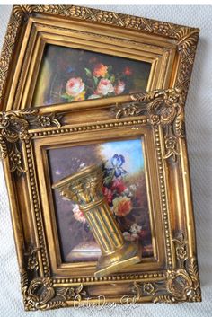 an ornate gold frame with flowers in it