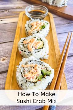 sushi crab mix with chopsticks and sauce in the middle on a wooden platter