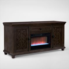 an entertainment center with a fireplace in the middle and flames coming out from its sides