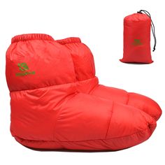 a red sleeping bag with the word green on it and an orange pouch next to it