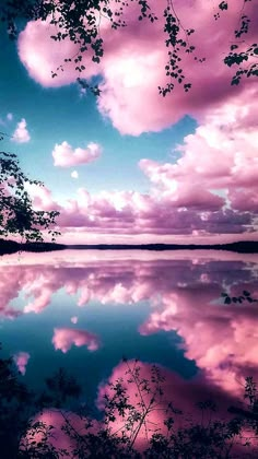 the sky and clouds are reflected in the water