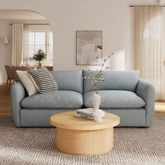 a living room with a blue couch and coffee table