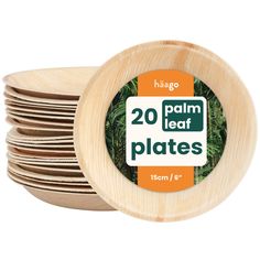 20 palm leaf plates with bamboo lids are stacked on top of each other in front of a white background