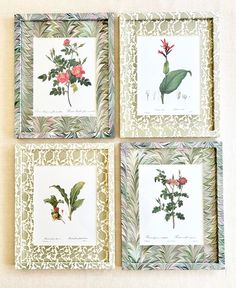 four framed pictures with flowers and leaves on them