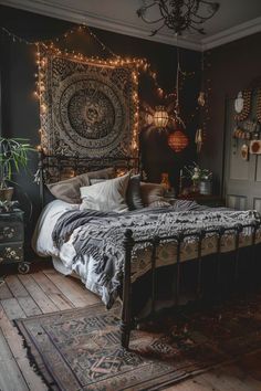 a bed room with a neatly made bed and lots of string lights on the wall