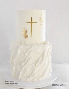 a large white cake with a cross on top