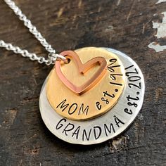 two necklaces that say mom and grandma on the same disc, one with a heart