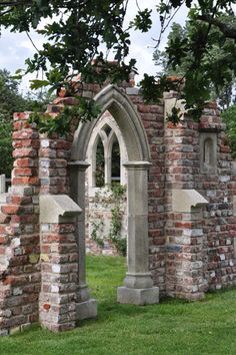 an old cemetery with brick walls and arches