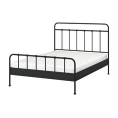 a metal bed frame with white sheets and black rails on the headboard, against a white background