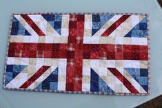 an union jack flag quilt on the hood of a car