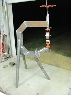 a large metal object sitting on top of a cement floor