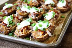 baked potato skins topped with sour cream and green onions