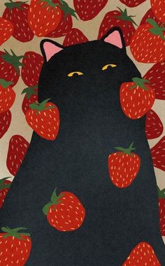 a black cat surrounded by red strawberries