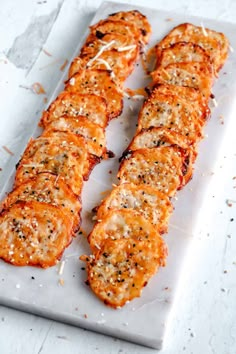 some food that is laying on a white tray and ready to be cooked in the oven