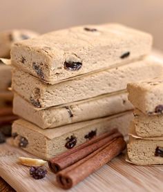 a stack of ice cream bars sitting on top of each other next to cinnamon sticks