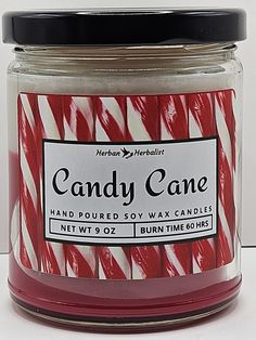 a red and white jar filled with candy cane