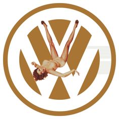 a woman is flying through the air in front of a vw logo