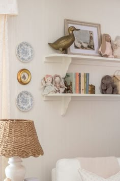 a living room filled with furniture and decor on top of bookshelves next to a window