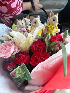 a bunch of stuffed animals sitting in a bouquet