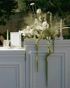 a table with flowers and candles on it