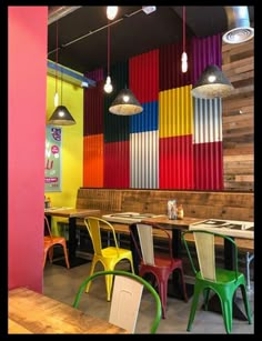 the interior of a restaurant with colorful walls